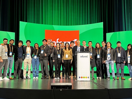 AI4OPT team at a conference